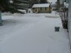 Unshovelled driveway with fresh snow