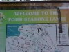 Sign for Welcome to the Four Seasons Lands