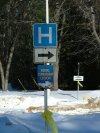 Signs for Deep River Hospital and Royal Canadian Legion with yellow ribbon