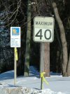 Maximum 40 km/hour sign with yellow ribbon