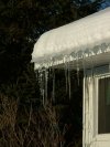 Winter icycles on roof gutters