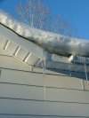 Winter icycles on roof gutters