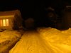 Snow and street scene at night
