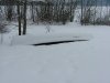 Canoe with covering of snow