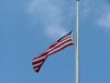 American Flag flying at half mast