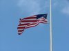 American Flag flying at half mast
