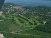 Aerial view: Ontario Hydro substation, Deep River golf course, Deep River Curling and Squash Club, township, marina and Ottawa River from the air