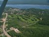 Aerial view: Ontario Hydro substation, Deep River golf course, Deep River Curling and Squash Club, township, marina and Ottawa River from the air