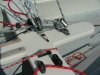 Albacore jib rigging for single handed.  The reason for jib cleats near the main sheet is that I can release the jib without having to let go of the mainsheet: as letting go of the mainsheet while setting the jib is an easy cause of turtling the boat. Port and starboard jib sheets are now different colours (blue and red).  Centerboard has a CL257 Auto-release Racing Mini Clamcleat with dinghy braid, as well as a backup Clamcleat with Shockcord