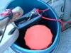 Big bucket with safety gear - all tethered.  Big bucket needed for bailing if Alabcore capsizes. But also needs to be tethered that is does not float or sink away during a capsize.