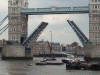 Small Tall ship going under the Tower Bridge