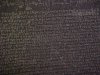 Blurred images of the Greek script on the Rosetta Stone