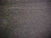 Blurred images of the Greek script on the Rosetta Stone