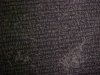 Blurred images of the Greek script on the Rosetta Stone
