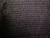 Blurred images of the Greek script on the Rosetta Stone