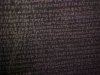 Blurred images of the Greek script on the Rosetta Stone