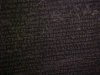 Blurred images of the Greek script on the Rosetta Stone