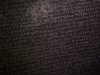 Blurred images of the Greek script on the Rosetta Stone