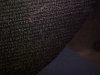 Blurred images of the Greek script on the Rosetta Stone