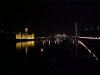 The Houses of Parliament and the London Eye edge on at night