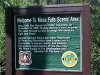 Sign welcoming you to Mesa Falls Scenic Area