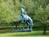 Statue of Abraham Lincoln, reading a book on a Horse munching grass