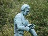 Statue of Abraham Lincoln, reading a book on a Horse munching grass